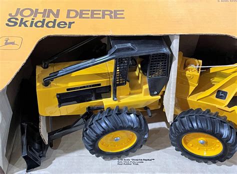 john deere toy skid steer|john deere log skidder toy.